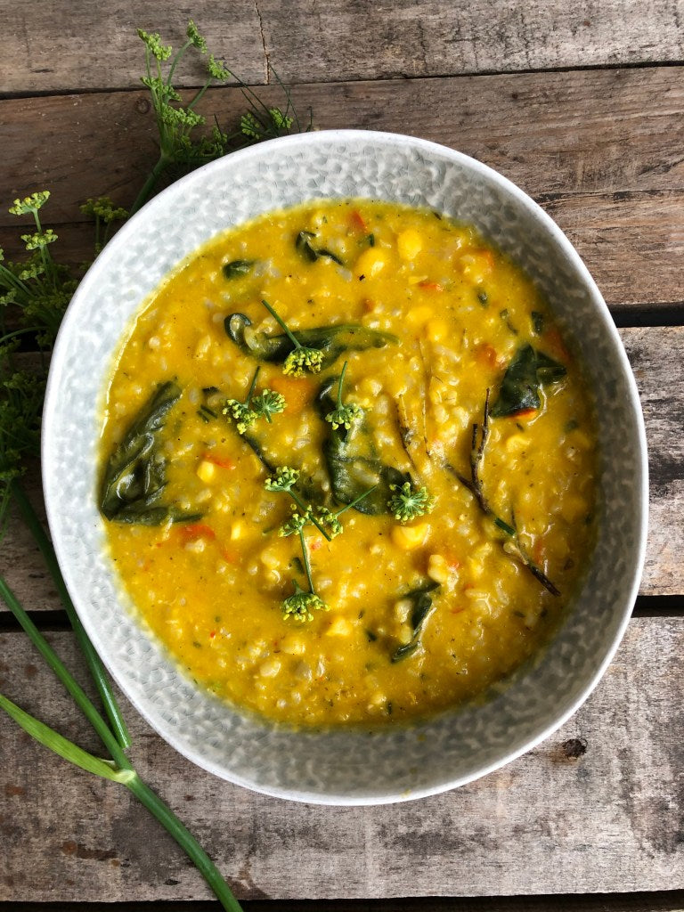 Romige rijst met pompoen en warmoes